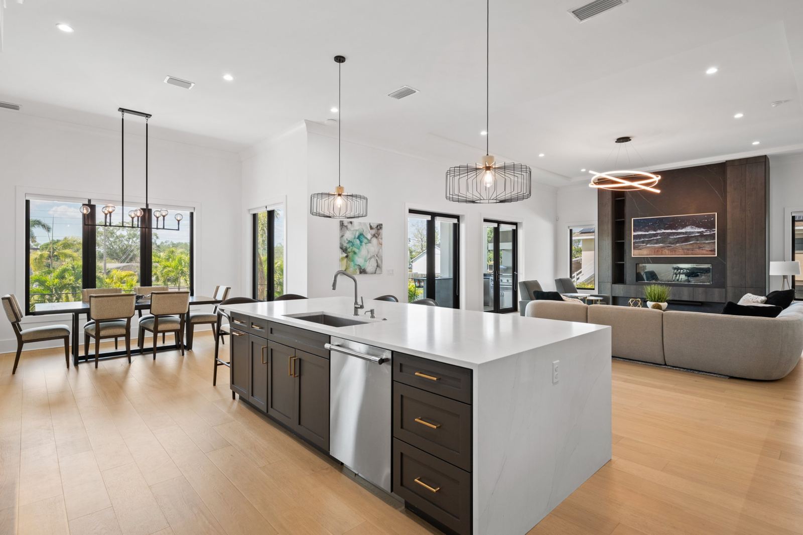 Open kitchen with waterfall island flowing into the living room
