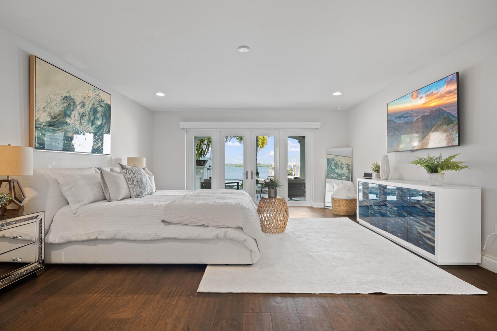 Waterfront condo living room with floor-to-ceiling sliders overlooking Tampa Bay