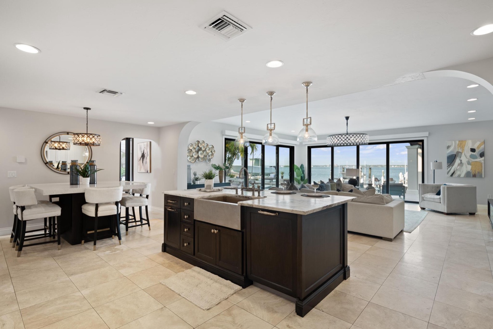 Waterfront primary bedroom with french doors opening to the intracoastal